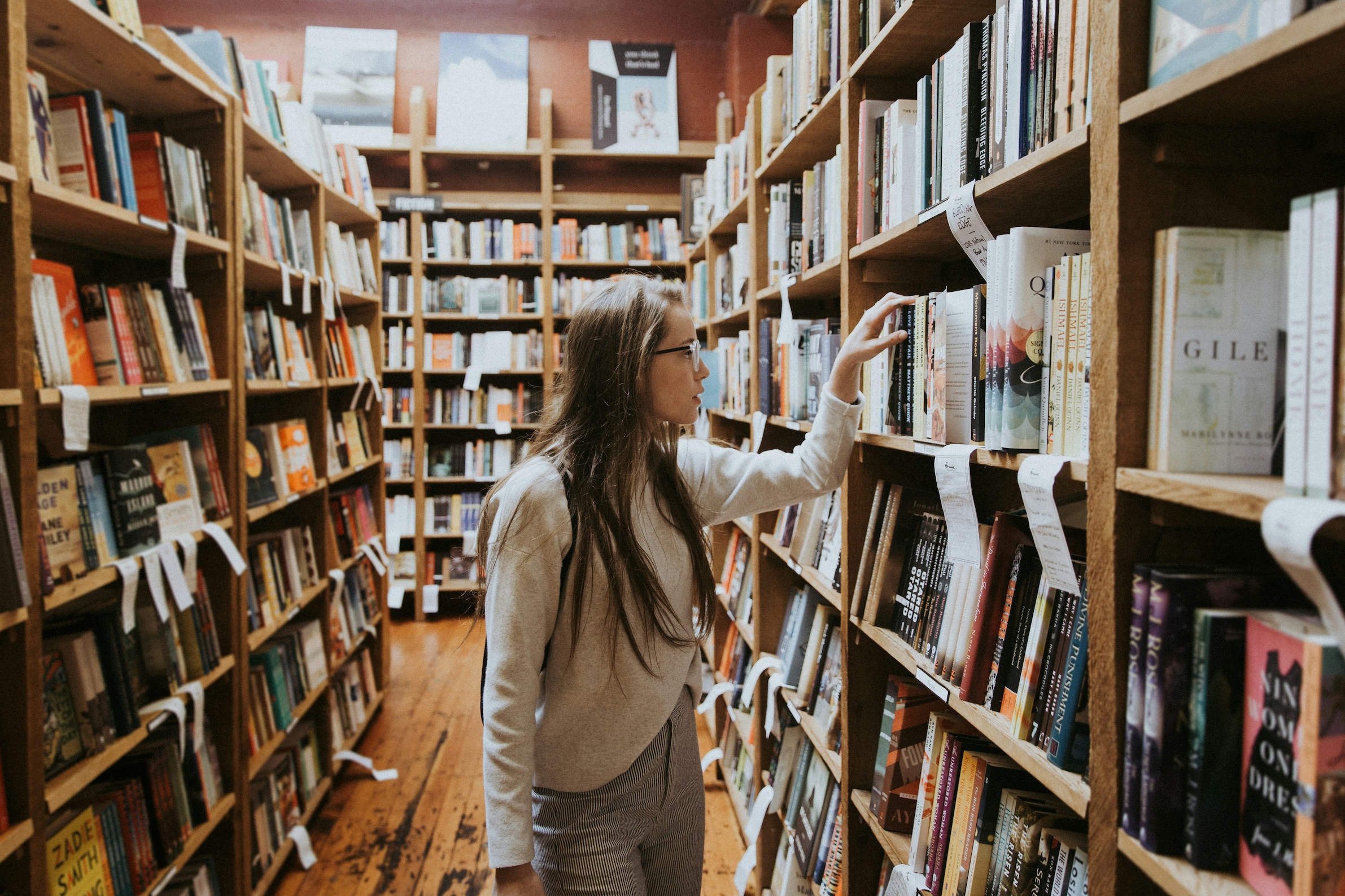Student looking through a library